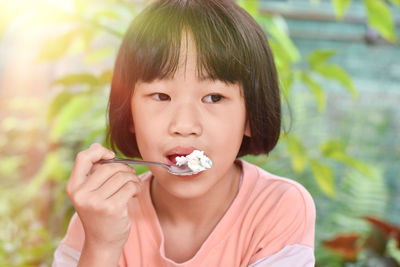 Portrait of cute boy eating food