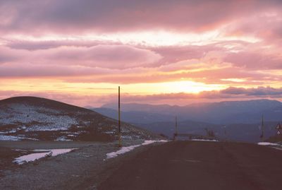 Scenic view of road against sky during sunset