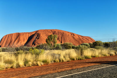 Scenic view of landscape against clear blue sky