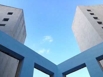 Low angle view of building against blue sky