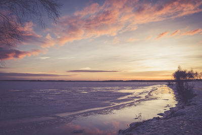 Scenic view of sea against sky at sunset