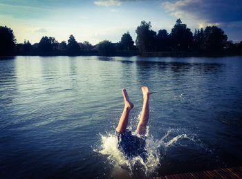 Man jumping in lake