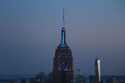 Low angle view of illuminated cityscape at night