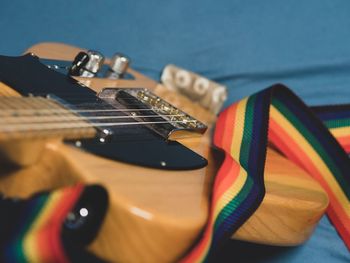 Close-up of guitar on table
