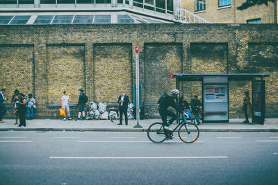 Bicycles on street against buildings in city