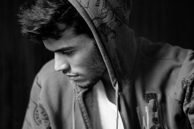 Close-up of a young man wearing hoodie