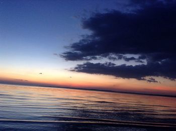 Scenic view of sea against dramatic sky