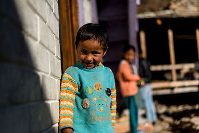 Boy standing outdoors