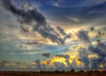 Scenic view of dramatic sky during sunset