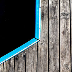 Pier over blue sea against sky