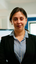 Portrait of businesswoman standing in office