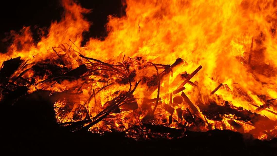 CLOSE-UP OF BONFIRE IN FIRE
