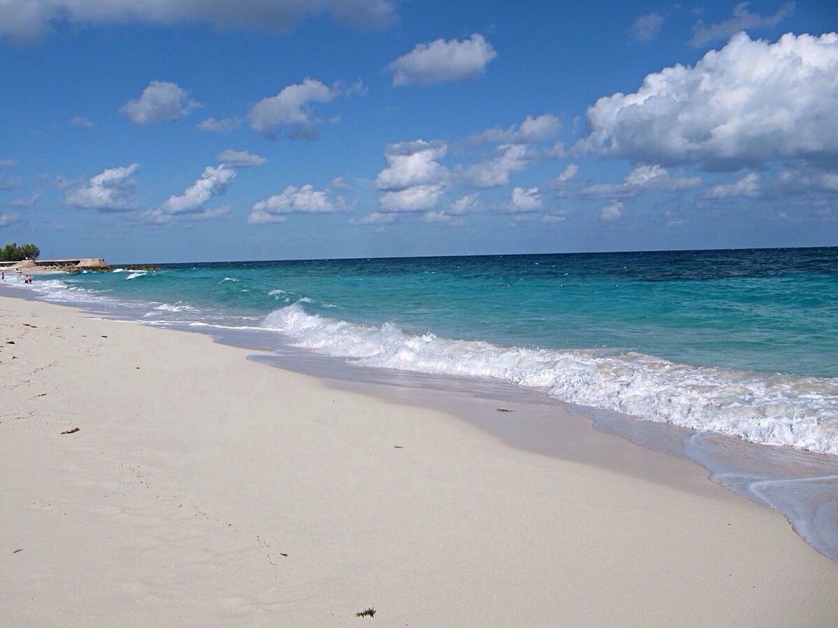 sea, beach, horizon over water, water, sand, shore, sky, wave, scenics, beauty in nature, tranquil scene, tranquility, surf, nature, blue, idyllic, coastline, cloud - sky, cloud, vacations