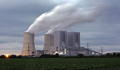 Panoramic view of factory against sky