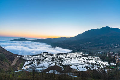 Scenic view of mountains against sky during winter