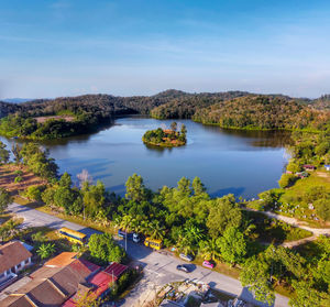 High angle view of city by road against sky