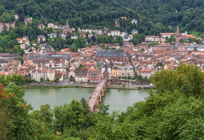 High angle view of river and buildings in city