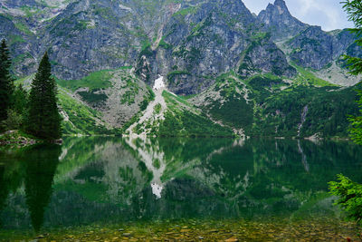 Mountains range near beautiful lake. tatra national park in poland. morskie oko or sea eye lake