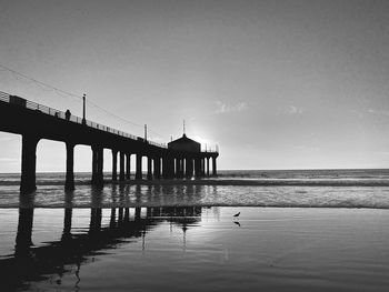 Pier over sea against sky