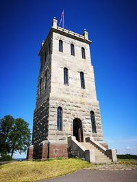 Low angle view of castle against clear blue sky