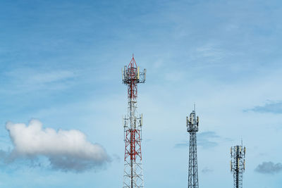 Telecommunication tower with blue sky and white clouds. antenna on blue sky. 