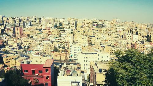 Aerial view of cityscape against clear sky