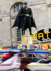 Statue against building