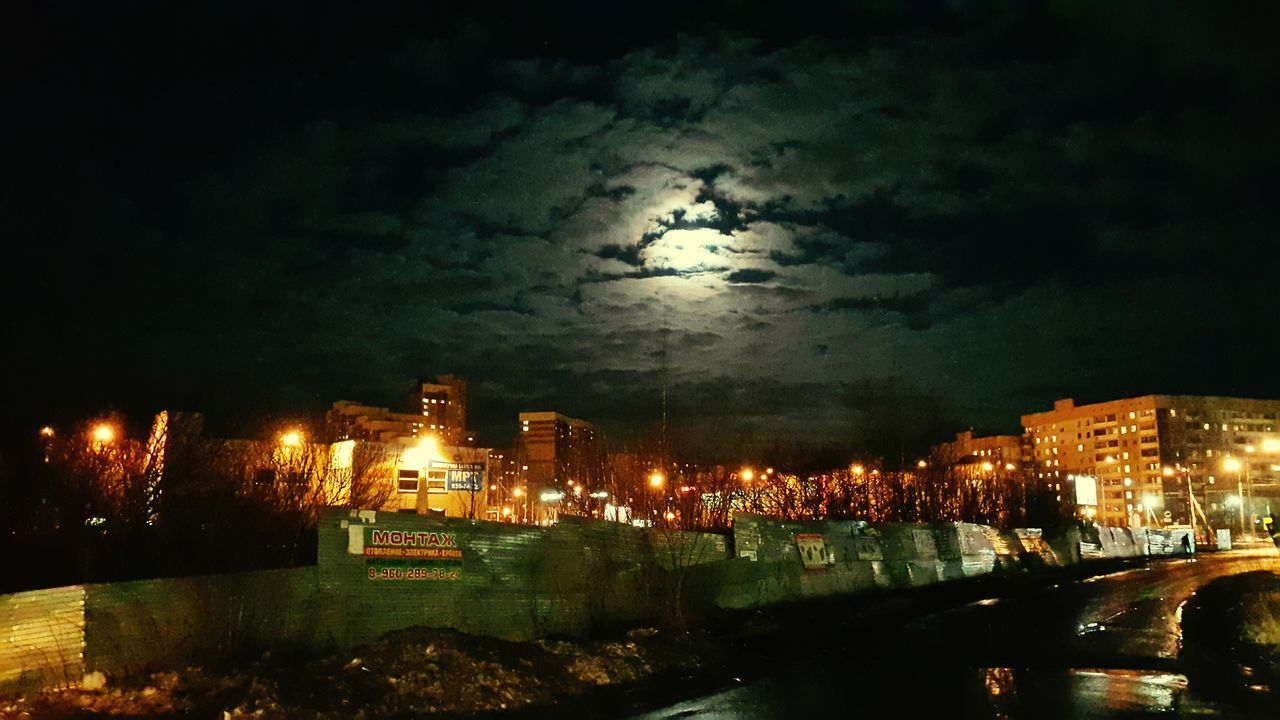 night, illuminated, architecture, city, built structure, building exterior, sky, water, cityscape, road, street light, transportation, street, river, high angle view, outdoors, no people, city life, bridge - man made structure, reflection