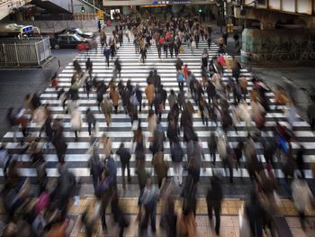 High angle view of people walking on road