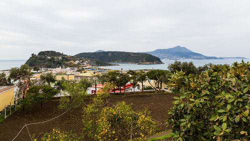 Scenic view of sea and buildings against sky