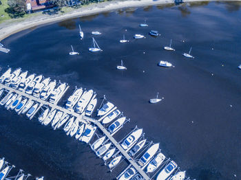 High angle view of cars on road by sea