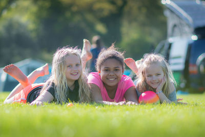 Portrait of happy girl on grass