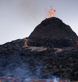 View of bonfire on mountain