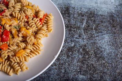 Pasta with peproni, tuna and onion. typical dish of the mediterranean diet