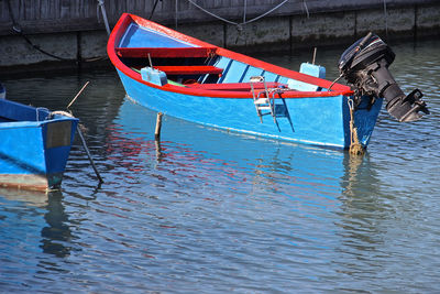 Fishing boat moored in lake