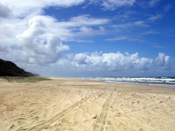 Scenic view of beach against sky