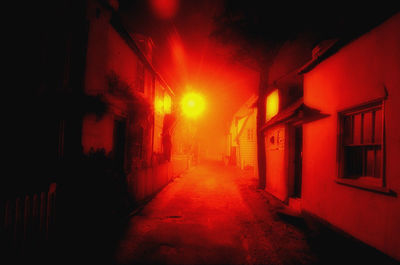 Illuminated walkway at night