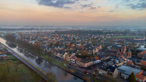 High angle view of townscape against sky during sunset