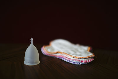 Stack of reusable sanitary pads and menstrual cup