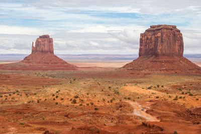 Rock formations and monument valley against sky