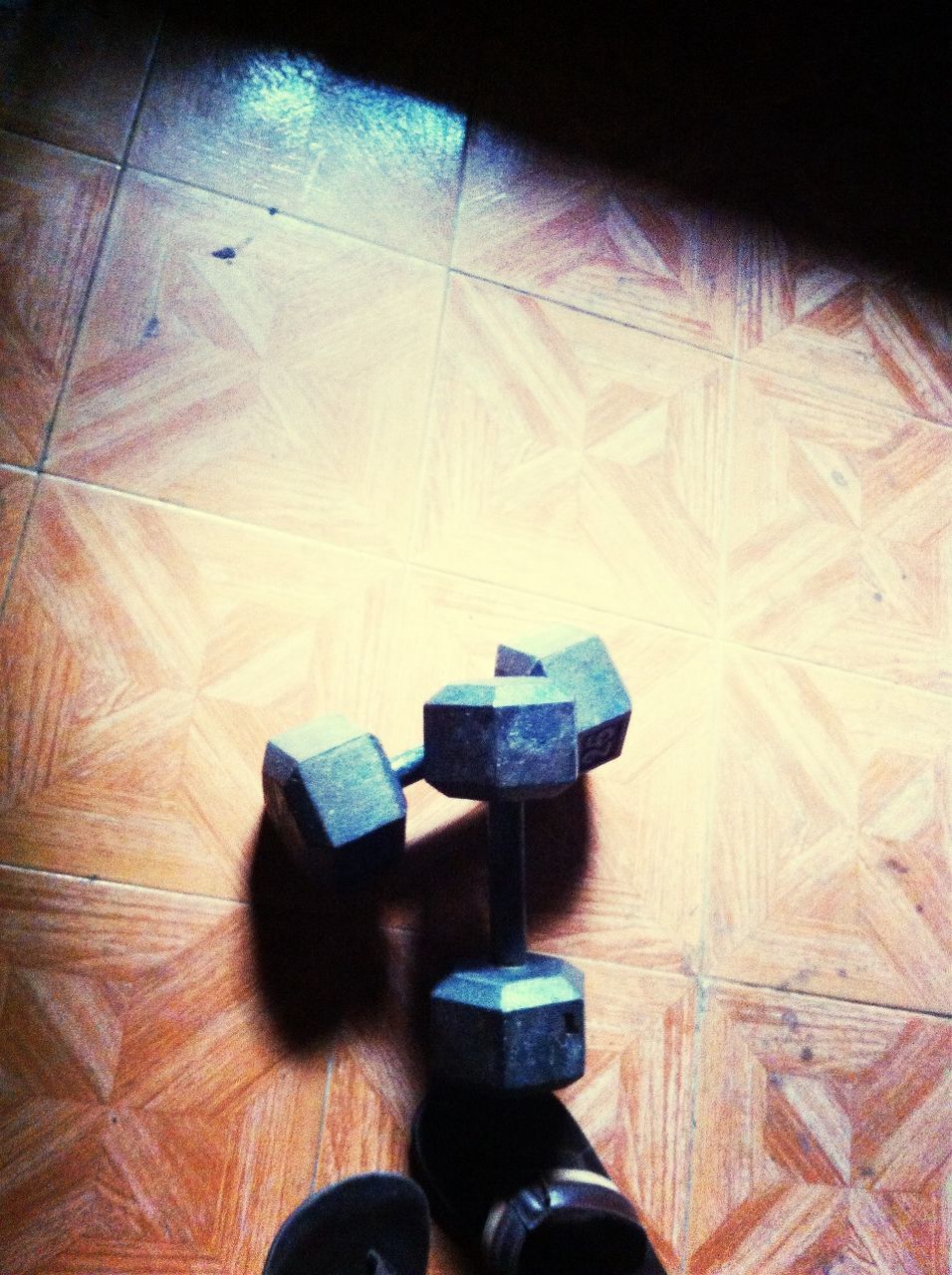 indoors, flooring, shoe, high angle view, floor, low section, person, tiled floor, hardwood floor, footwear, still life, table, shadow, close-up, pattern, pair, wood - material, absence