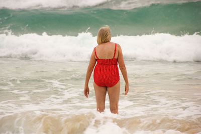 Rear view of woman on beach