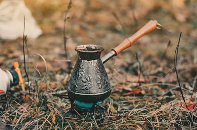 Turk with coffee on dry grass. outdoor recreation. autumn.