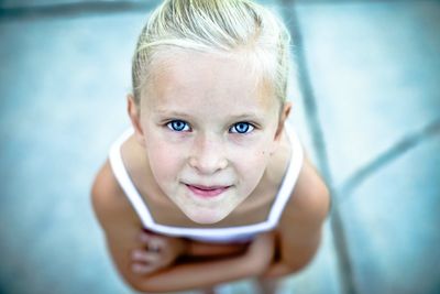 Close-up portrait of a cute girl with blue eyes