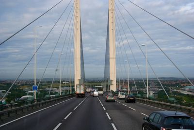 View of bridge against cloudy sky