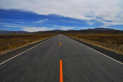 Empty road passing through landscape