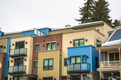 Low angle view of buildings against clear sky