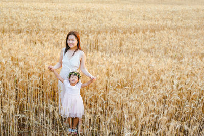 Young woman standing on field