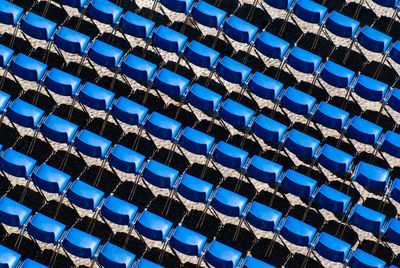 Rows of empty blue seats