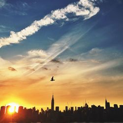 Silhouette of city at sunset